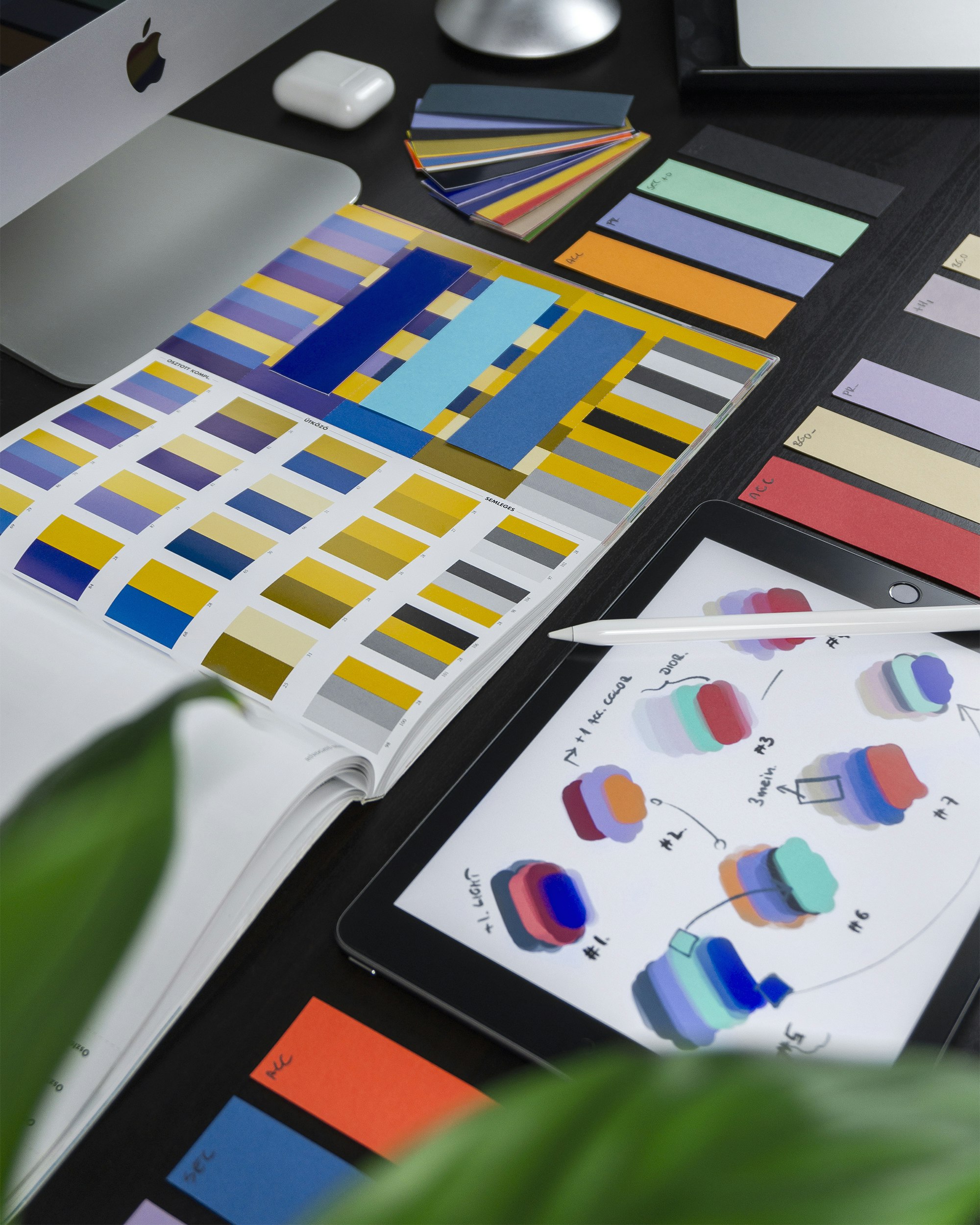 Brand identity work in progress on a studio desk